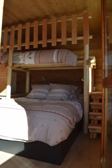 A bedroom with a double bed 140 and a single bed 90 on the mezzanine and television