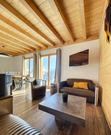 Living room with television and stove.