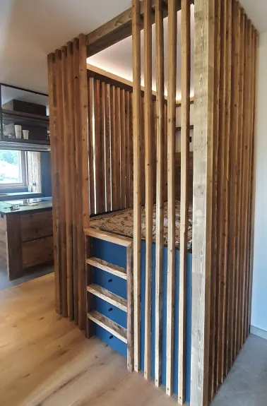 Alcove in the living room, with a double bed, for a 4th bedroom with curtains to isolate from light