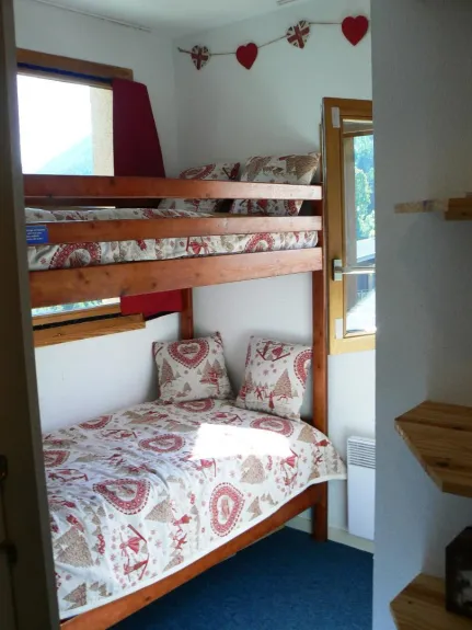 second bedroom with bunk beds (with comfortable matresses) and shelves