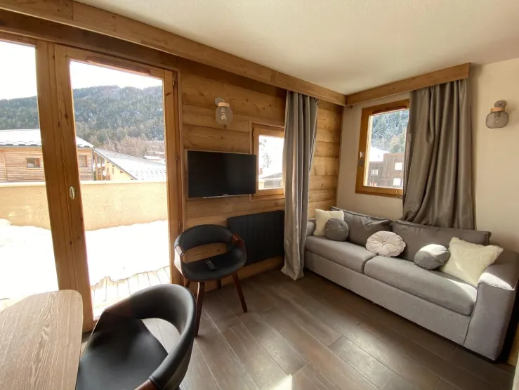 The living room, terrace side, ski slopes view