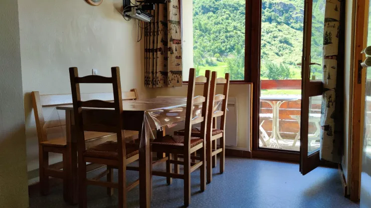Key dining area with access to the balcony equipped with table, chairs and loungers. Thereis also has a TV and DVD player.