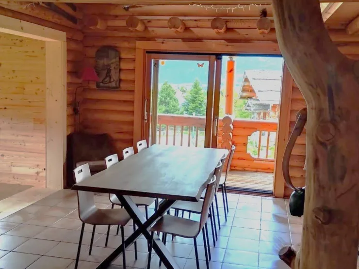 Your spacious living room, where a large dining table for 8 to 10 people awaits you. Perfect for meals with family or friends.