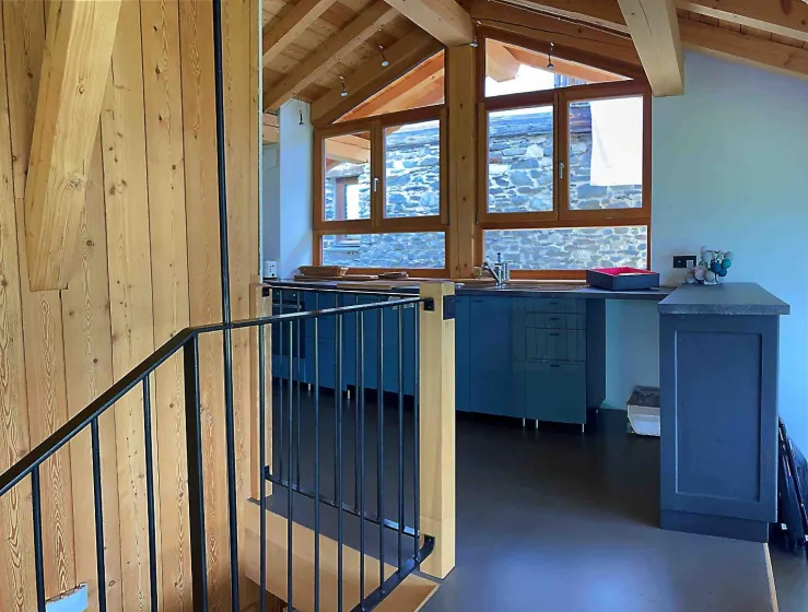 A fully equipped kitchen , open to the living space