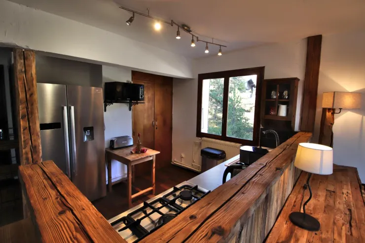 The fully equipped kitchen on the first floor open to the dining room and the living room