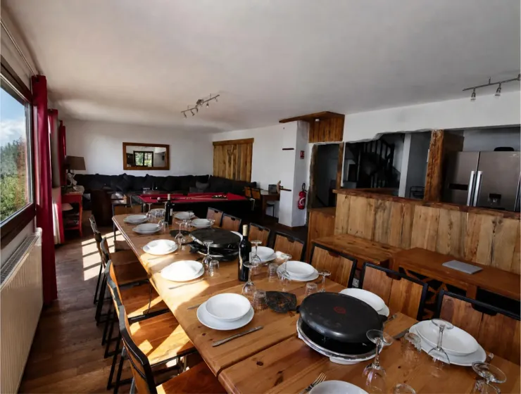 First floor: Dining room separated from the kitchen by an old wooden bar that seats 16 to 18 guests
